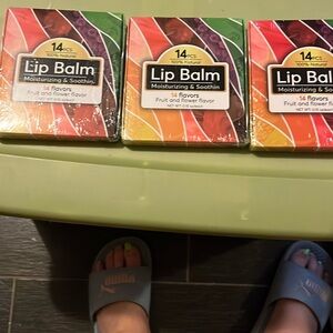 Three packages with 14 each in it lip balm, brand new